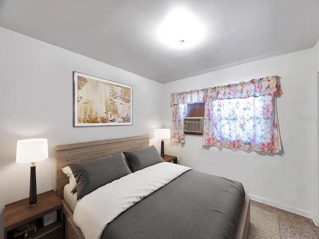 bedroom with carpet flooring, baseboards, and cooling unit