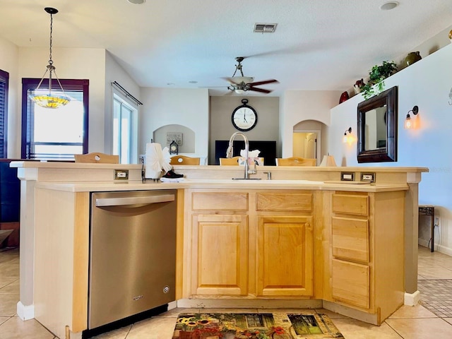kitchen with dishwasher, arched walkways, a ceiling fan, light tile patterned floors, and visible vents