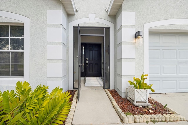 entrance to property with stucco siding