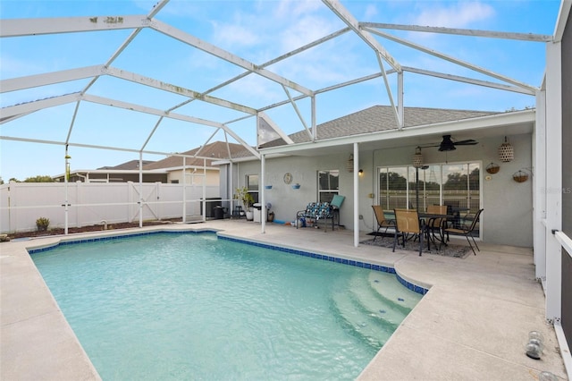 view of swimming pool with a fenced in pool, a ceiling fan, a patio area, and fence