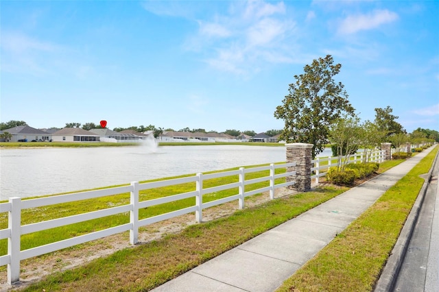exterior space with fence and a residential view