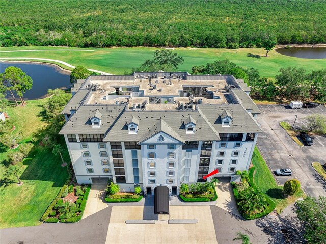 14820 Rue De Bayonne Unit 208, Clearwater, FL 33762 - aerial view with a water view, a view of trees, and golf course view