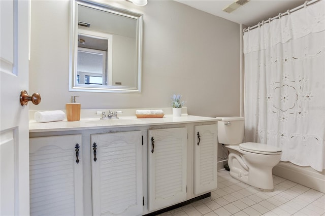 14820 Rue De Bayonne Unit 208, Clearwater, FL 33762 - full bathroom with vanity, tile patterned flooring, toilet, and visible vents