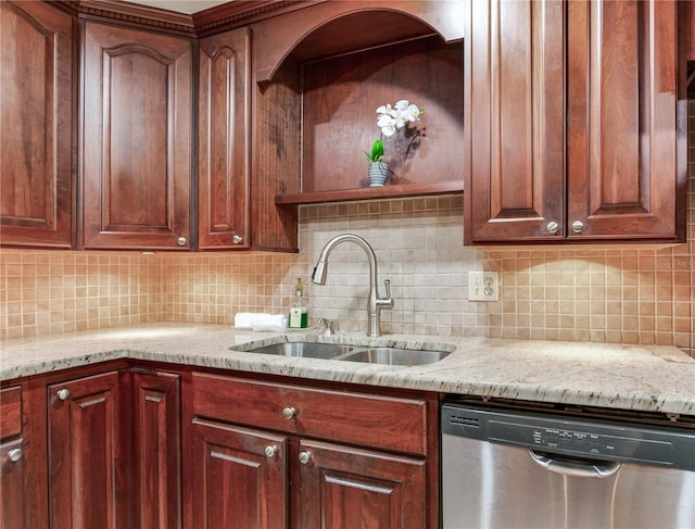 14820 Rue De Bayonne Unit 208, Clearwater, FL 33762 - kitchen featuring a sink, backsplash, dishwasher, and light stone countertops