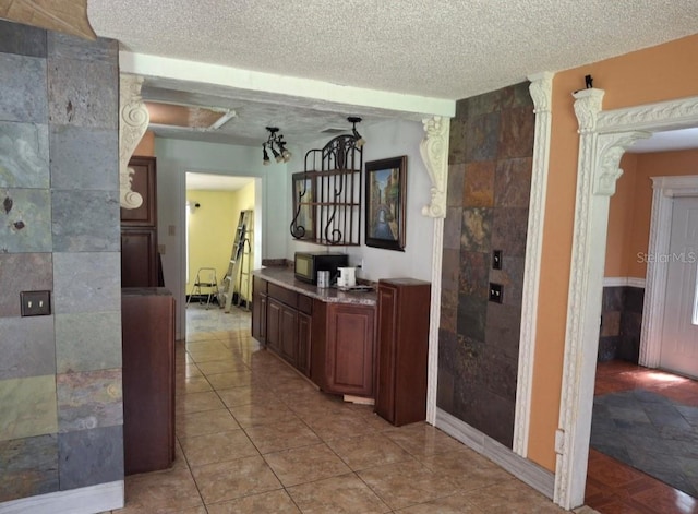 11305 SW 186th Cir, Dunnellon, FL 34432 - hall featuring a textured ceiling and light tile patterned floors