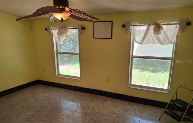 11305 SW 186th Cir, Dunnellon, FL 34432 - empty room featuring healthy amount of natural light and baseboards