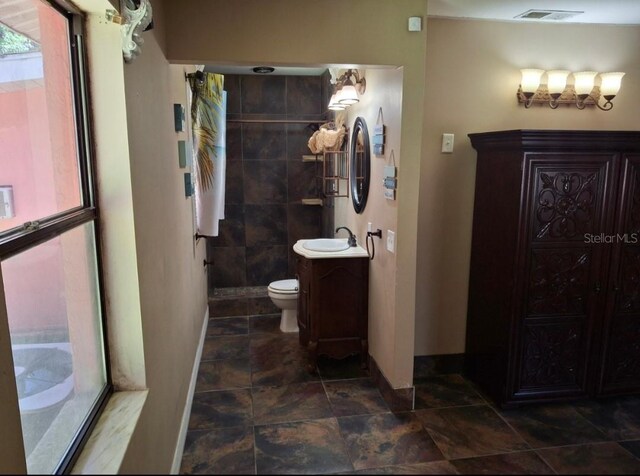 11305 SW 186th Cir, Dunnellon, FL 34432 - full bathroom with baseboards, vanity, and toilet