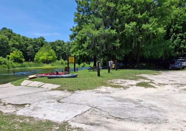 11305 SW 186th Cir, Dunnellon, FL 34432 - view of property's community with a water view and a yard