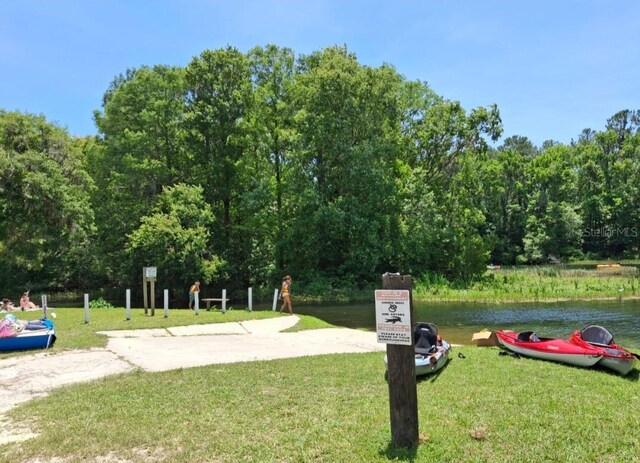 11305 SW 186th Cir, Dunnellon, FL 34432 - view of community with a lawn and a water view