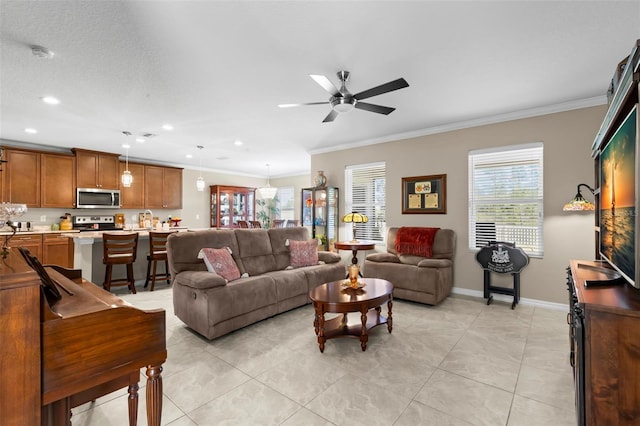 living area featuring crown molding, ceiling fan, recessed lighting, baseboards, and light tile patterned floors