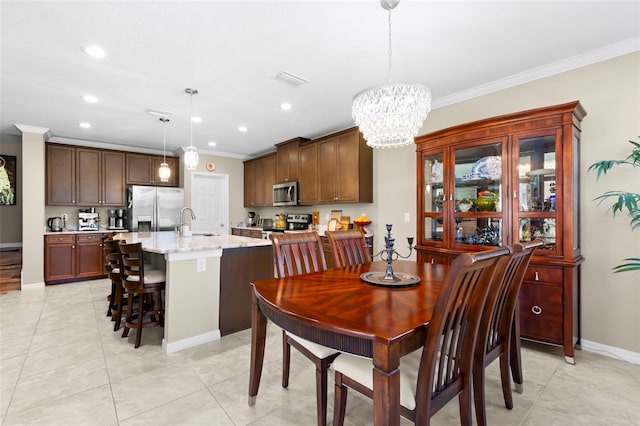 dining area with crown molding, recessed lighting, baseboards, and a chandelier