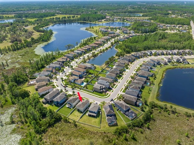 bird's eye view with a residential view and a water view