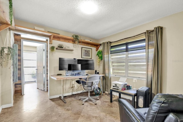 office with a textured ceiling and baseboards
