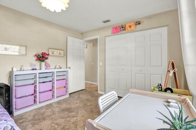 bedroom with visible vents and a closet