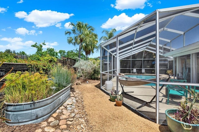 view of yard featuring a patio, a lanai, and an outdoor pool