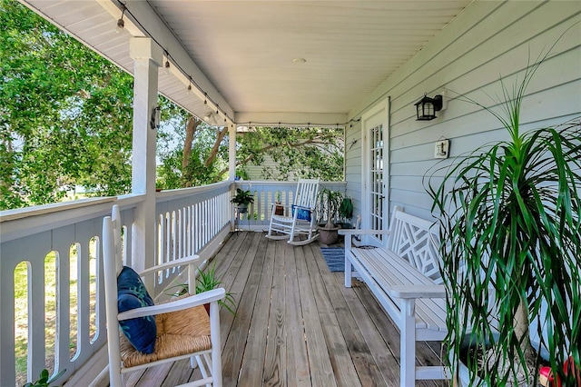 13974 75th Ave, Seminole, FL 33776 - wooden deck with covered porch