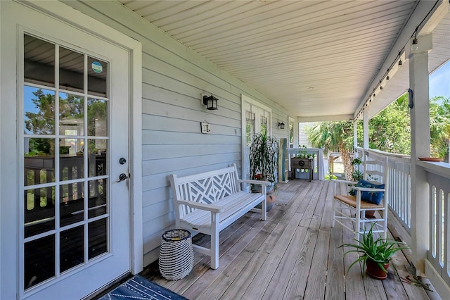 13974 75th Ave, Seminole, FL 33776 - wooden terrace featuring a porch