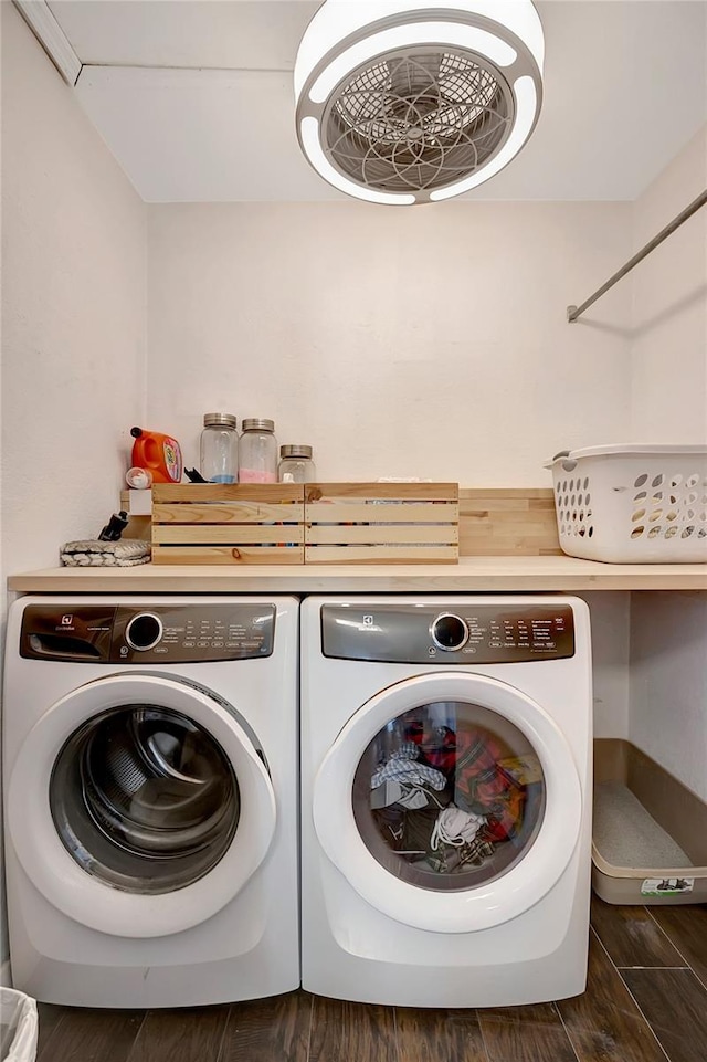 13974 75th Ave, Seminole, FL 33776 - clothes washing area with washing machine and clothes dryer and wood finished floors
