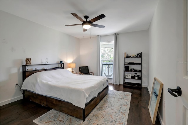 13974 75th Ave, Seminole, FL 33776 - bedroom with dark wood finished floors, baseboards, and ceiling fan