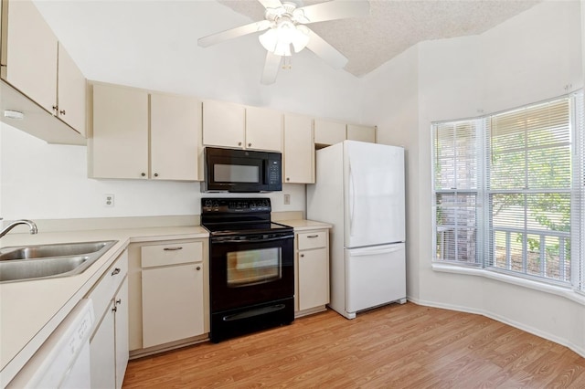 kitchen with black appliances, a sink, light wood-style floors, light countertops, and ceiling fan