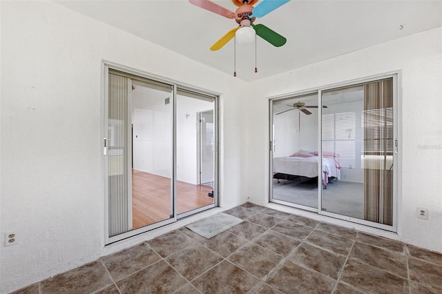 unfurnished bedroom featuring a closet and ceiling fan