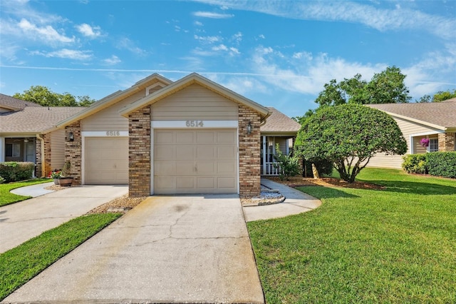 ranch-style house with a front lawn, a garage, brick siding, and driveway