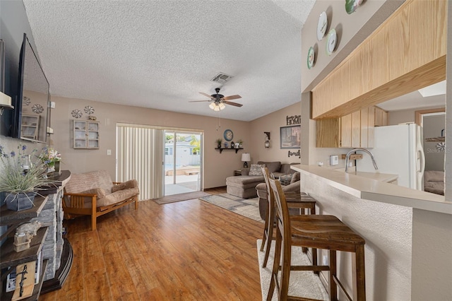 2153 Catalina Dr N, Clearwater, FL 33763 - dining space with a ceiling fan, light wood-type flooring, and a textured ceiling