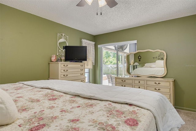 2153 Catalina Dr N, Clearwater, FL 33763 - bedroom featuring access to exterior, carpet flooring, a ceiling fan, and a textured ceiling