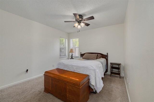 2153 Catalina Dr N, Clearwater, FL 33763 - bedroom featuring carpet floors, baseboards, a textured ceiling, and ceiling fan
