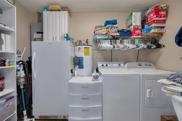 2153 Catalina Dr N, Clearwater, FL 33763 - laundry room featuring cabinet space, independent washer and dryer, electric water heater, and a textured ceiling