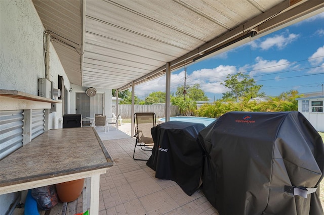 2153 Catalina Dr N, Clearwater, FL 33763 - fenced backyard with a grill, a patio, and outdoor dining space