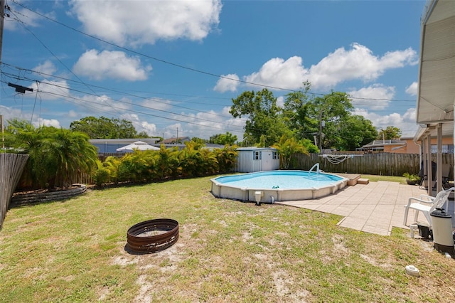 2153 Catalina Dr N, Clearwater, FL 33763 - view of yard featuring a patio and a storage unit