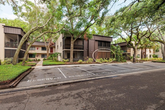 11708 Raintree Village Blvd Unit A, Temple Terrace, FL 33617 - view of building exterior with uncovered parking