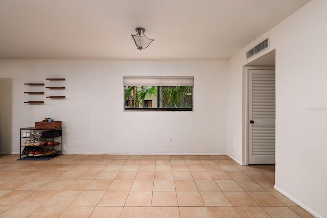11708 Raintree Village Blvd Unit A, Temple Terrace, FL 33617 - empty room featuring light tile patterned floors and visible vents