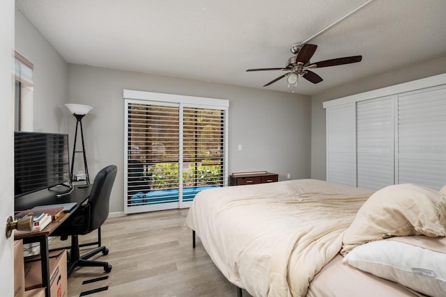 11708 Raintree Village Blvd Unit A, Temple Terrace, FL 33617 - bedroom with light wood-style floors, a ceiling fan, and access to exterior