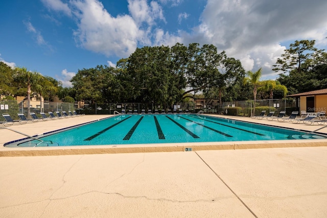 11708 Raintree Village Blvd Unit A, Temple Terrace, FL 33617 - community pool with a patio area and fence