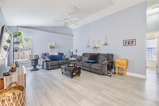 18013 Palm Breeze Dr, Tampa, FL 33647 - living area featuring baseboards, a ceiling fan, light wood-style flooring, and lofted ceiling