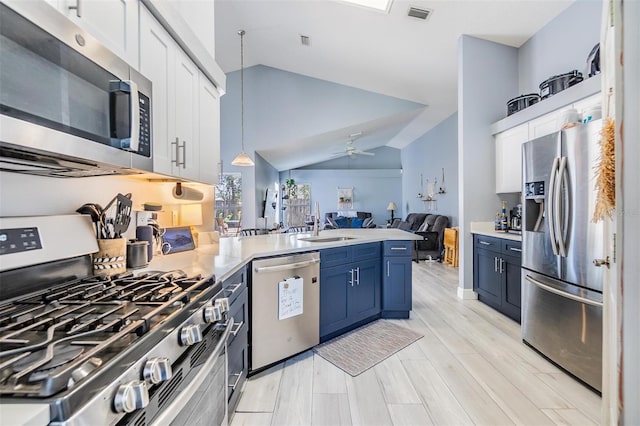 18013 Palm Breeze Dr, Tampa, FL 33647 - kitchen with a sink, stainless steel appliances, open floor plan, a peninsula, and visible vents