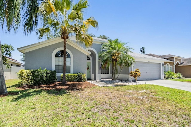18013 Palm Breeze Dr, Tampa, FL 33647 - view of front of property featuring concrete driveway, an attached garage, a front lawn, and stucco siding