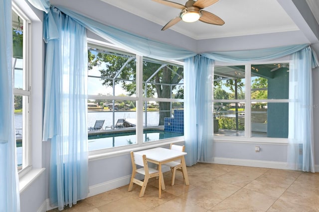 sunroom / solarium with a water view