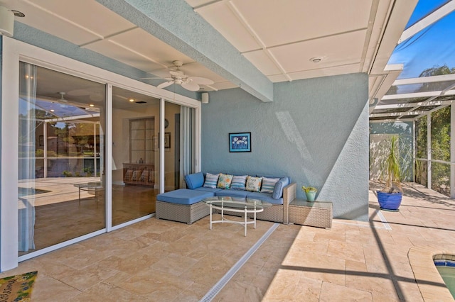 view of patio featuring ceiling fan, outdoor lounge area, and a lanai