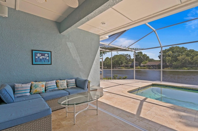 view of pool with a water view, an outdoor living space, a lanai, and a patio area