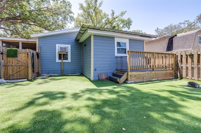 5304 Cherry Ave, Seffner, FL 33584 - back of property with fence, a deck, a gate, metal roof, and a lawn