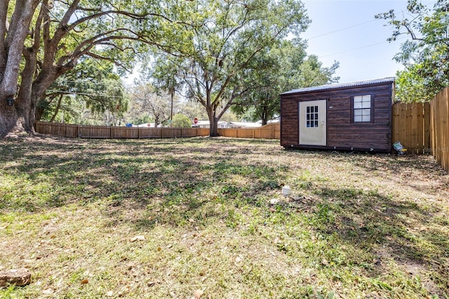 5304 Cherry Ave, Seffner, FL 33584 - view of yard with a fenced backyard, an outdoor structure, and a storage shed