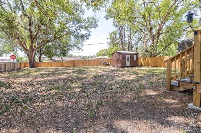 5304 Cherry Ave, Seffner, FL 33584 - view of yard featuring a storage shed, an outdoor structure, and a fenced backyard
