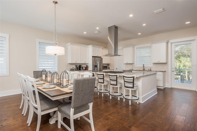 265 Causeway Blvd Unit 7, Dunedin, FL 34698 - dining room with recessed lighting, dark wood-type flooring, and baseboards