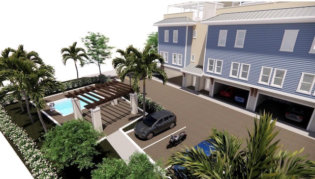 265 Causeway Blvd Unit 7, Dunedin, FL 34698 - rear view of property featuring uncovered parking, a standing seam roof, and metal roof