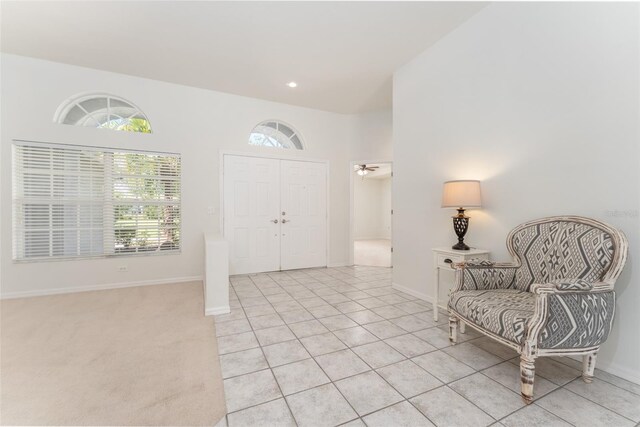 entryway featuring baseboards, recessed lighting, and light tile patterned floors