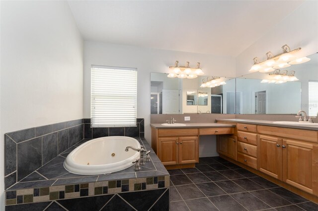 bathroom with vanity, plenty of natural light, a whirlpool tub, and a shower stall