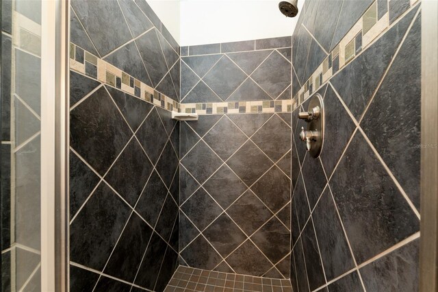 full bathroom with a tile shower